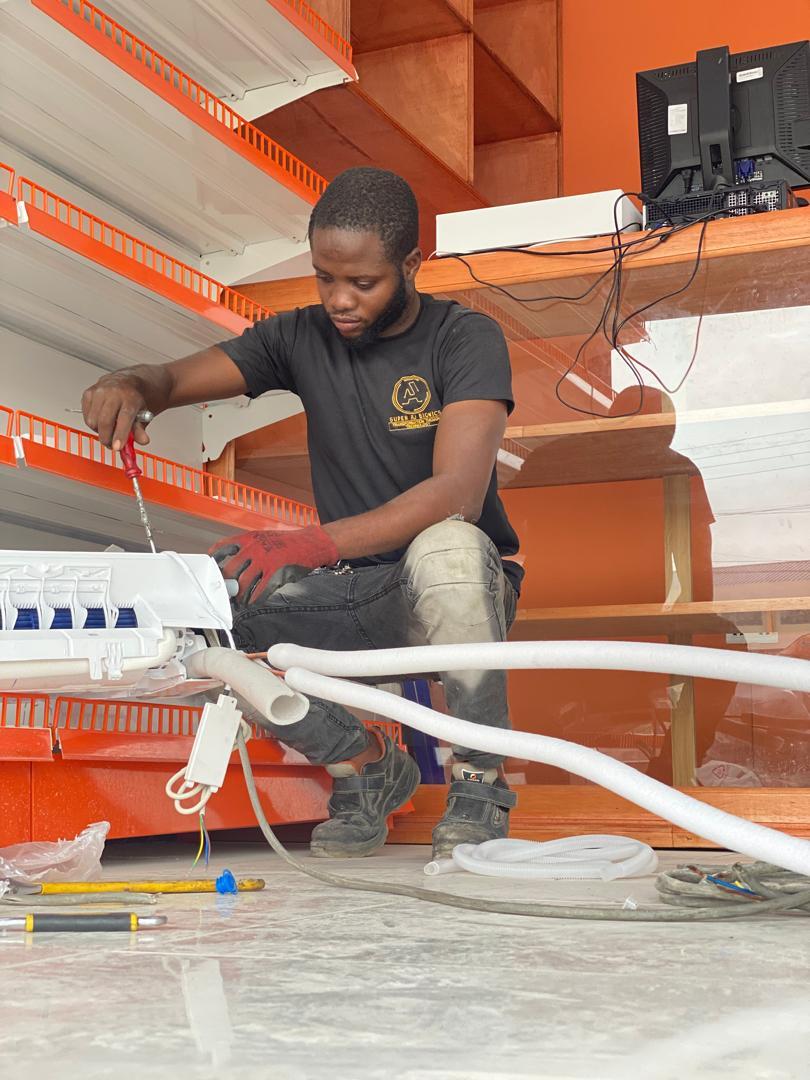 Technician installing a new HVAC unit