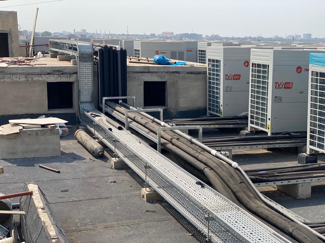 Rooftop VRF condensing units and insulated refrigerant piping installed in Accra